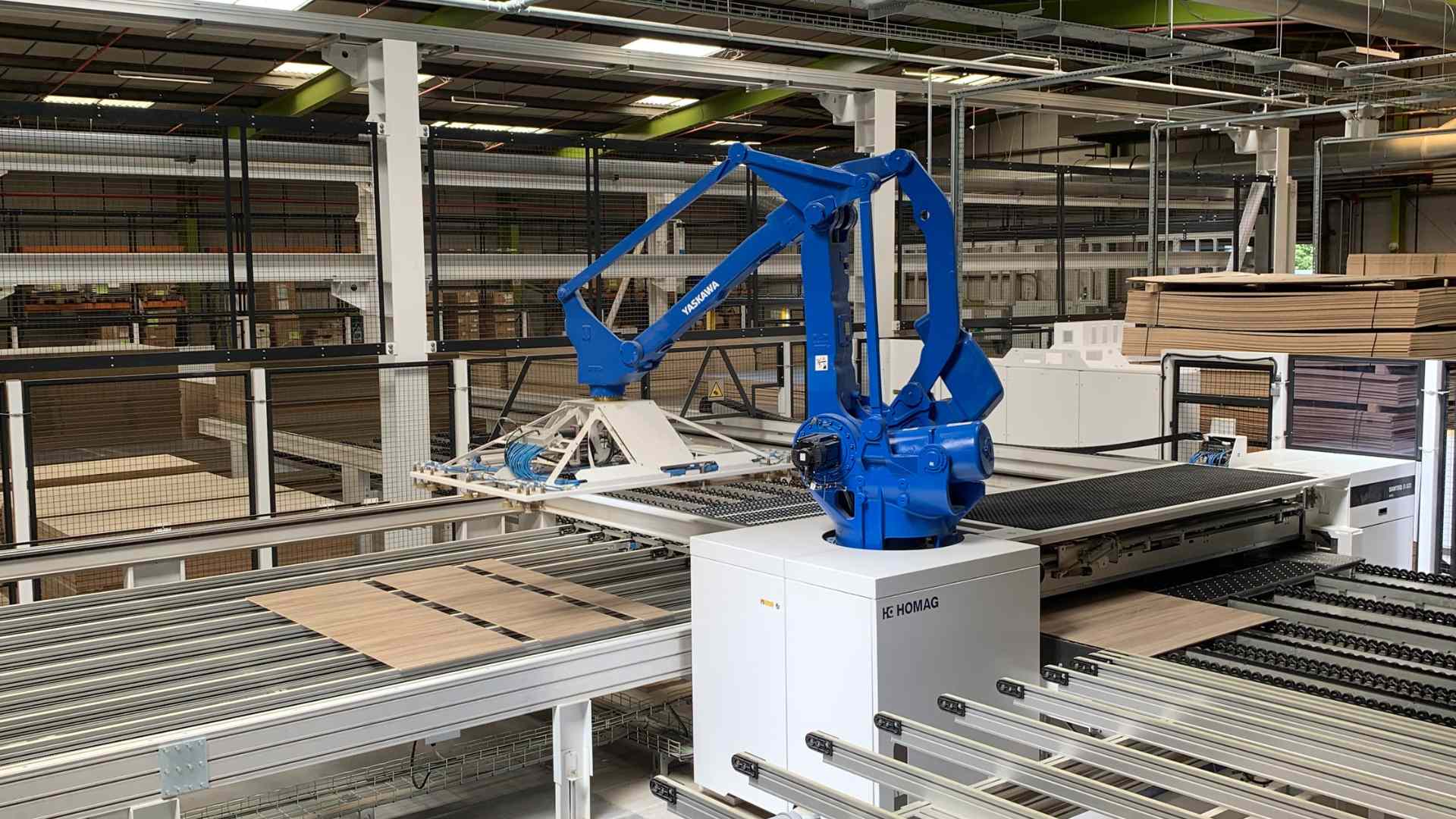 Blue-Homag-machine-preparing-furniture-to-be-manufactured